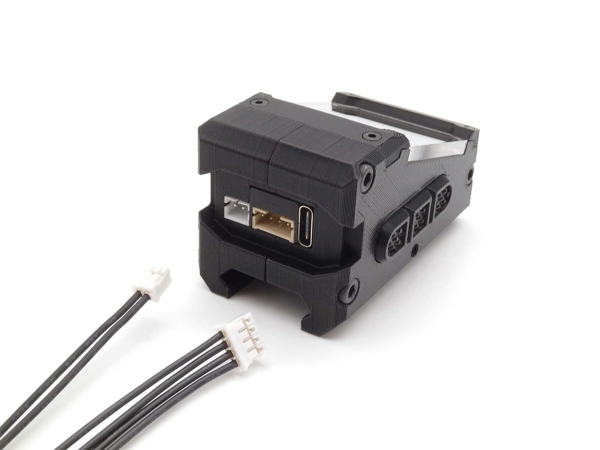 A rear view of the display unit showing the sensor cable and the external button cable ready to be plugged in