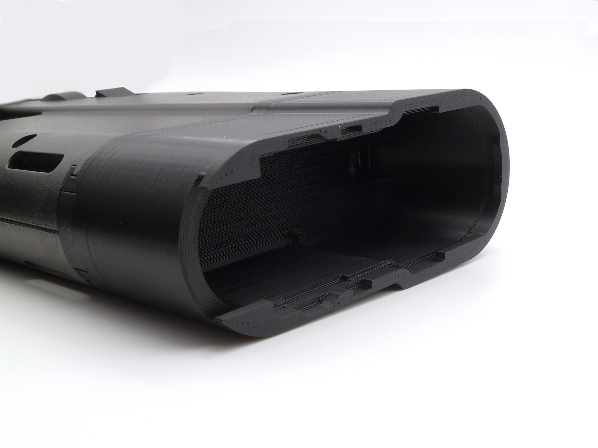Attached to a Tokyo Marui P90, but a view inside with the buttstock cap removed