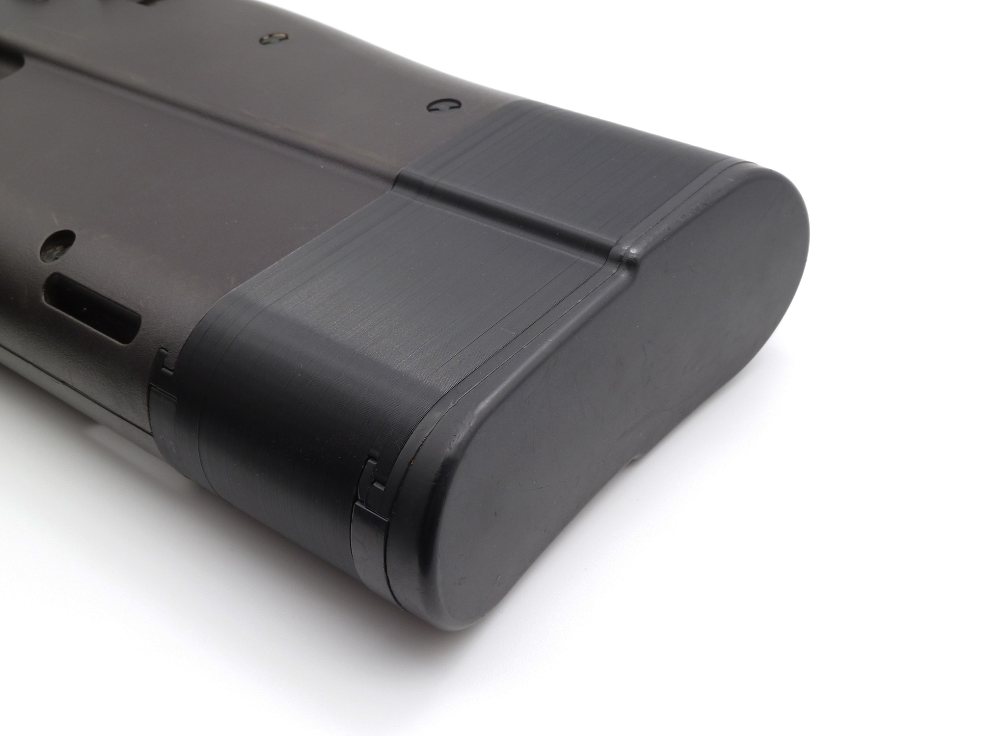 Attached to a Tokyo Marui P90, buttstock cap attached