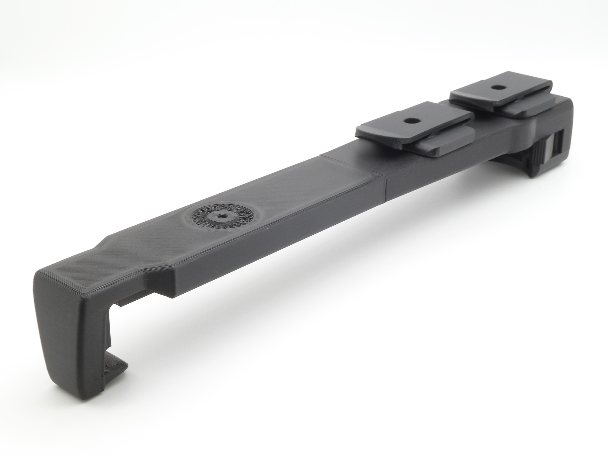 The unit flipped upside down, showing the attachment points for the MOLLE adapter plates